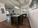 Bright dining area with modern table and seating for four at 8020 Tuscany Way # 6103, Davenport, FL 33896