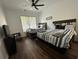 Guest bedroom with two twin beds, wood floors, and window at 8020 Tuscany Way # 6103, Davenport, FL 33896