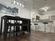 Dining area with dark wood table and four chairs at 8020 Tuscany Way # 6103, Davenport, FL 33896