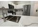 Modern kitchen with stainless steel appliances and white cabinets at 8020 Tuscany Way # 6103, Davenport, FL 33896
