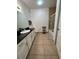 Bathroom with white cabinets, granite countertop, and bathtub at 8020 Tuscany Way # 6103, Davenport, FL 33896