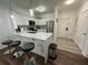 Modern kitchen with breakfast bar and stainless steel appliances at 8020 Tuscany Way # 6103, Davenport, FL 33896