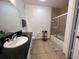 Bathroom with white cabinets, granite countertop, and bathtub at 8020 Tuscany Way # 6103, Davenport, FL 33896