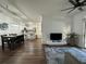Open living room with wood flooring and modern decor at 8020 Tuscany Way # 6103, Davenport, FL 33896