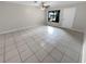 Large living room with tile floors and plenty of natural light at 220 Cherokee Ct # 107, Altamonte Springs, FL 32701