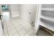 Updated kitchen with white cabinets and tile flooring at 220 Cherokee Ct # 107, Altamonte Springs, FL 32701