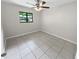 Bright bedroom with tile floor, ceiling fan, and window at 220 Cherokee Ct # 107, Altamonte Springs, FL 32701