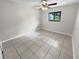 Spacious bedroom featuring tile floors and a ceiling fan at 220 Cherokee Ct # 107, Altamonte Springs, FL 32701