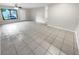 Large living room with tile floors and exterior view at 220 Cherokee Ct # 107, Altamonte Springs, FL 32701