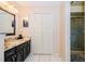 Bathroom with double vanity, granite countertop, and separate shower at 5924 White Egret Ln, Orlando, FL 32810