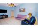 Living area with a flat-screen TV and comfortable seating at 5924 White Egret Ln, Orlando, FL 32810