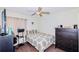 Simple bedroom with a double bed and dresser at 5924 White Egret Ln, Orlando, FL 32810