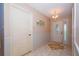 Bright and spacious entryway with tile floors and a decorative rug at 5924 White Egret Ln, Orlando, FL 32810