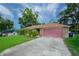 Brick home with a large green lawn at 5924 White Egret Ln, Orlando, FL 32810