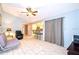 Living room with tiled floor, couch and view of kitchen at 5924 White Egret Ln, Orlando, FL 32810