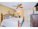 Main bedroom with a king-size bed and ceiling fan at 5924 White Egret Ln, Orlando, FL 32810