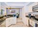 Kitchen boasts granite countertops, stainless steel appliances, and ample cabinet space at 5924 White Egret Ln, Orlando, FL 32810