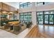 Community clubhouse lobby with comfortable seating and pool views at 2476 Pine Preserve Ct, St Cloud, FL 34771