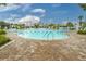 Community pool with ample deck space at 2476 Pine Preserve Ct, St Cloud, FL 34771