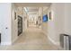 Long hallway in the clubhouse with modern light fixtures at 2476 Pine Preserve Ct, St Cloud, FL 34771