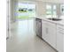 Modern kitchen with white cabinets, stainless steel appliances, and a large island at 2476 Pine Preserve Ct, St Cloud, FL 34771