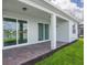 Covered patio with sliding glass doors leading to the interior at 2476 Pine Preserve Ct, St Cloud, FL 34771