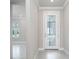 Inviting entryway with a modern white door and glass accents at 2476 Pine Preserve Ct, St Cloud, FL 34771