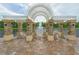 Seating area with a pergola and fountain view at 2476 Pine Preserve Ct, St Cloud, FL 34771
