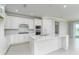 Spacious kitchen with white island and stainless steel appliances at 2476 Pine Preserve Ct, St Cloud, FL 34771