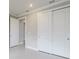 Well-lit bedroom with neutral walls and double doors at 2476 Pine Preserve Ct, St Cloud, FL 34771
