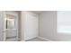 Bright bedroom with double doors leading to en-suite bathroom at 2476 Pine Preserve Ct, St Cloud, FL 34771