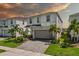 Two-story home with gray siding and a two-car garage at 1697 Kona Ln, Davenport, FL 33897