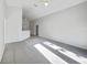 Bright and airy living room with grey carpet and lots of natural light at 1078 Osprey Cove Cir, Groveland, FL 34736