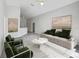 Spacious living room with a neutral color scheme and stylish furniture at 1078 Osprey Cove Cir, Groveland, FL 34736