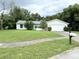 Single-story home with a two-car garage and well-maintained lawn at 7817 Satsuma Ct, Orlando, FL 32835