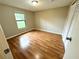 Bright bedroom with wood-look floors and ample closet space at 7817 Satsuma Ct, Orlando, FL 32835