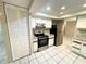 Modern kitchen featuring stainless steel appliances and granite countertops at 7817 Satsuma Ct, Orlando, FL 32835