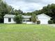 Single story home with attached garage and well-maintained lawn at 7817 Satsuma Ct, Orlando, FL 32835