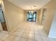 Bright dining room with tile floors and access to a screened porch at 7817 Satsuma Ct, Orlando, FL 32835