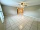 Spacious living room with tile floors and ceiling fan at 7817 Satsuma Ct, Orlando, FL 32835
