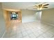 Spacious living area with tile flooring and access to dining area at 7817 Satsuma Ct, Orlando, FL 32835