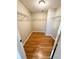 Walk-in closet with wire shelving and wood-look flooring at 7817 Satsuma Ct, Orlando, FL 32835