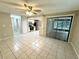 Open concept living and kitchen area with tile floors at 7817 Satsuma Ct, Orlando, FL 32835