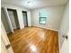 Second bedroom with wood-look floors and double closets at 7817 Satsuma Ct, Orlando, FL 32835