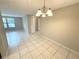 Bright dining area with tile floors and a chandelier at 7817 Satsuma Ct, Orlando, FL 32835