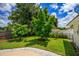 Landscaped backyard with mature trees and grassy area at 609 Applewood Ave, Altamonte Springs, FL 32714