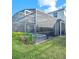 Screened pool and spa area with lush landscaping at 2031 Lelani Cir, Davenport, FL 33897