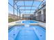 Relaxing pool and spa with screened enclosure at 2031 Lelani Cir, Davenport, FL 33897