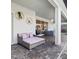 Covered patio with comfortable seating and modern decor at 2031 Lelani Cir, Davenport, FL 33897