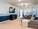 Upstairs bonus room with sectional sofa and large TV at 2031 Lelani Cir, Davenport, FL 33897